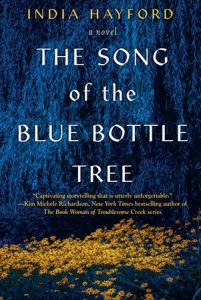 Book Cover - The Song of the Blue Bottle Tree by India Hayford. Dark Blue background with faint image of a tree and yellow flowers
